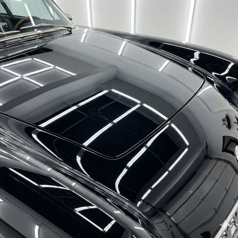 A mirror-like, high-gloss finish on a restored classic car demonstrates our commitment to superior paint and bodywork. A mirror-like, high-gloss finish on a restored classic car demonstrates our commitment to superior paint and bodywork.